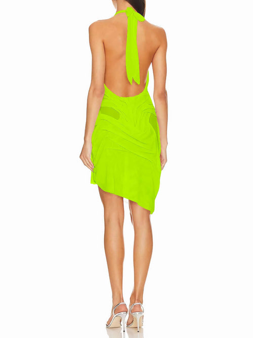 Back view of neon yellow wet look dress, open low back design.
