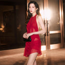 Model wearing Lookegarment Red Wet Look Party Dress from The Party Edit, perfect for statement evening wear and high-fashion events.