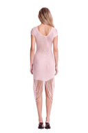 Back view of the light pink asymmetric sheer midi dress, showing a scooped back neckline and long draped fringe.