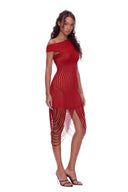 Angled front view of the red asymmetric draped sheer midi dress, showing an asymmetric neckline, curved sheer stripes and long looped fringe.