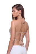Aurevia halter crop top in Metallic Gold, back three-quarter view showing the two back ties.