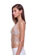 Aurevia halter crop top in Metallic Gold, side view showing the shaped feather-like edges and open back.