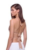 Aurevia halter crop top in Metallic Rose, back three-quarter view showing the two back ties.
