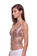 Aurevia halter crop top in Metallic Rose, front three-quarter view of the metallic phoenix design.