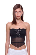 Aveline 3D hand-painted floral tie-back crop top in Black, front view showing the strapless neckline, raised floral detail and pointed hem