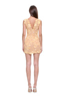 Calanthe floral mini dress in Sungold, back view showing the V neckline and center-back zipper