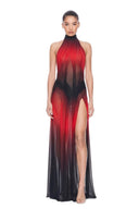 Front view of the Eclipse red and black gradient maxi dress with a high halter neckline, sheer panels and a long skirt with a thigh-high slit.
