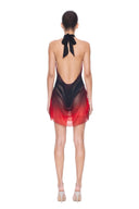 Back view of the Eclipse red and black gradient mini dress, showing the halter tie, plunging open back and draped mini hem.