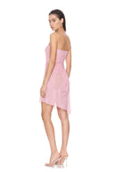 Angled back view of the light pink Eos strapless wet look midi dress, showing the garment silhouette and back detailing.