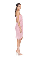 Side view of the light pink Eos strapless wet look midi dress, showing gathered draping and an asymmetric hem.