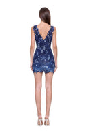 Fiora hand-painted floral mini dress in Blue Ombre, back view showing the V back and raised flower and leaf pattern