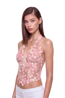 Florielle floral halter top in Blush Pink, three-quarter front view showing raised hand-painted flowers, hand-beaded centers and the shaped hem.