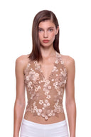 Florielle floral halter top in Warm Nude, front view showing raised hand-painted flowers, hand-beaded centers and a shaped hem.
