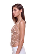 Florielle floral halter top in Warm Nude, side view showing the floral mesh panels and cropped silhouette.
