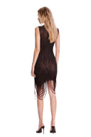 Angled back view of the black fringed sheer asymmetric mini dress, showing the garment silhouette and back detailing.