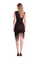 Back view of the black fringed sheer mini dress, showing curved stripe panels and the looped fringe hem.