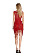 Back view of the red fringed sheer mini dress, showing the sleeveless cut, curved stripe pattern and looped asymmetric hem.