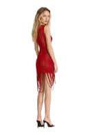 Opposite back angle view of the red fringed sheer asymmetric mini dress, showing a sleeveless silhouette, curved sheer stripes and looped fringe at the hem.