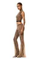 Side view of The Lace Temptation Set in Nude Mesh and Black Lace with cropped high-neck top and body-contouring flared trousers
