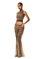 Three-quarter front view of The Lace Temptation Set showing hand-draped nude mesh over black lace and flared trousers
