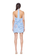 Back view of the baby blue Liquid Aura halter mini dress with long neck ties and draping over sheer mesh panels.