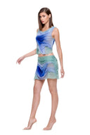 Three-quarter front view of the Marea Moonlight Gradient set, showing curved draping and sheer hip detailing.
