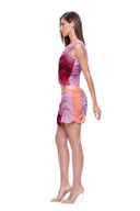 Side view of the Marea Sunset Gradient skirt set, showing the cropped top, sheer hip panel and asymmetric mini hem.