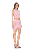 Front three-quarter view of the Marea Light Pink wetlook two-piece set with layered draping and sheer hip panels