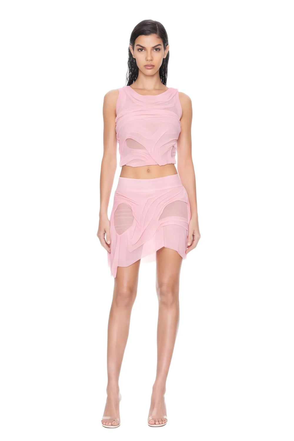 Front view of the light pink Marea wetlook two-piece set, showing a sleeveless draped crop top and asymmetric mini skirt.