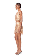 Side view of the Marea Metallic Gold wetlook two-piece set with reflective draping and sheer hip panel