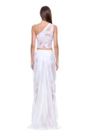 Back view of the Nerina white wet look crop top and matching skirt with sheer panels and gathered folds