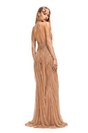 Back three-quarter view of the Nerissa nude pearl-embroidered wetlook gown with plunging open back and draped floor-length mesh