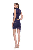 Rear three-quarter view of the Nysa navy skirt set with sheer back panels and an asymmetric hem