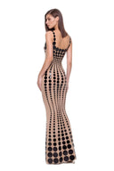 Back three-quarter view of the Oria Black/Nude gown with a scooped back and floor-length hem.