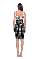 Oria hand-painted dot knee-length dress in White/Black, back view showing the scooped back and graduated dot pattern