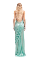 Back view of the Siren mint green wetlook long dress featuring a dramatic open back and fluid floor-length draping