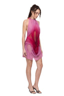 Detailed angled view of the Solara wetlook mini dress showing hand-draped ombre folds and sheer illusion panels