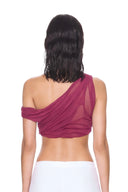 back view of the Thalia Fuchsia One-Sleeve Wet Look Crop Top, with a single shoulder strap, one short off-shoulder sleeve and sheer draping.