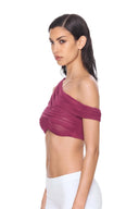 side view of the Thalia Fuchsia One-Sleeve Wet Look Crop Top, with a single shoulder strap, one short off-shoulder sleeve and sheer draping.