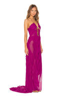 Front three-quarter view of the fuchsia Venus wet look gown, showing a chain neckline, bodice cutouts and a long draped skirt.