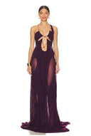 Front view of the modena purple Venus wet look gown, showing a chain neckline, bodice cutouts and a long draped skirt.
