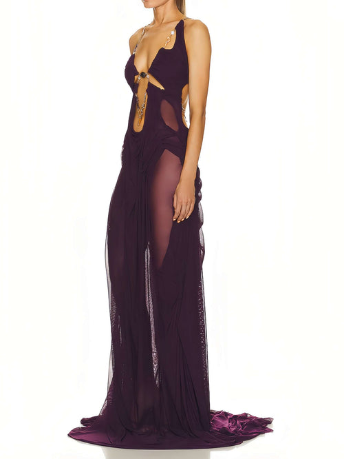 Model displaying right side of modena Venus gown, sheer fabric flow.